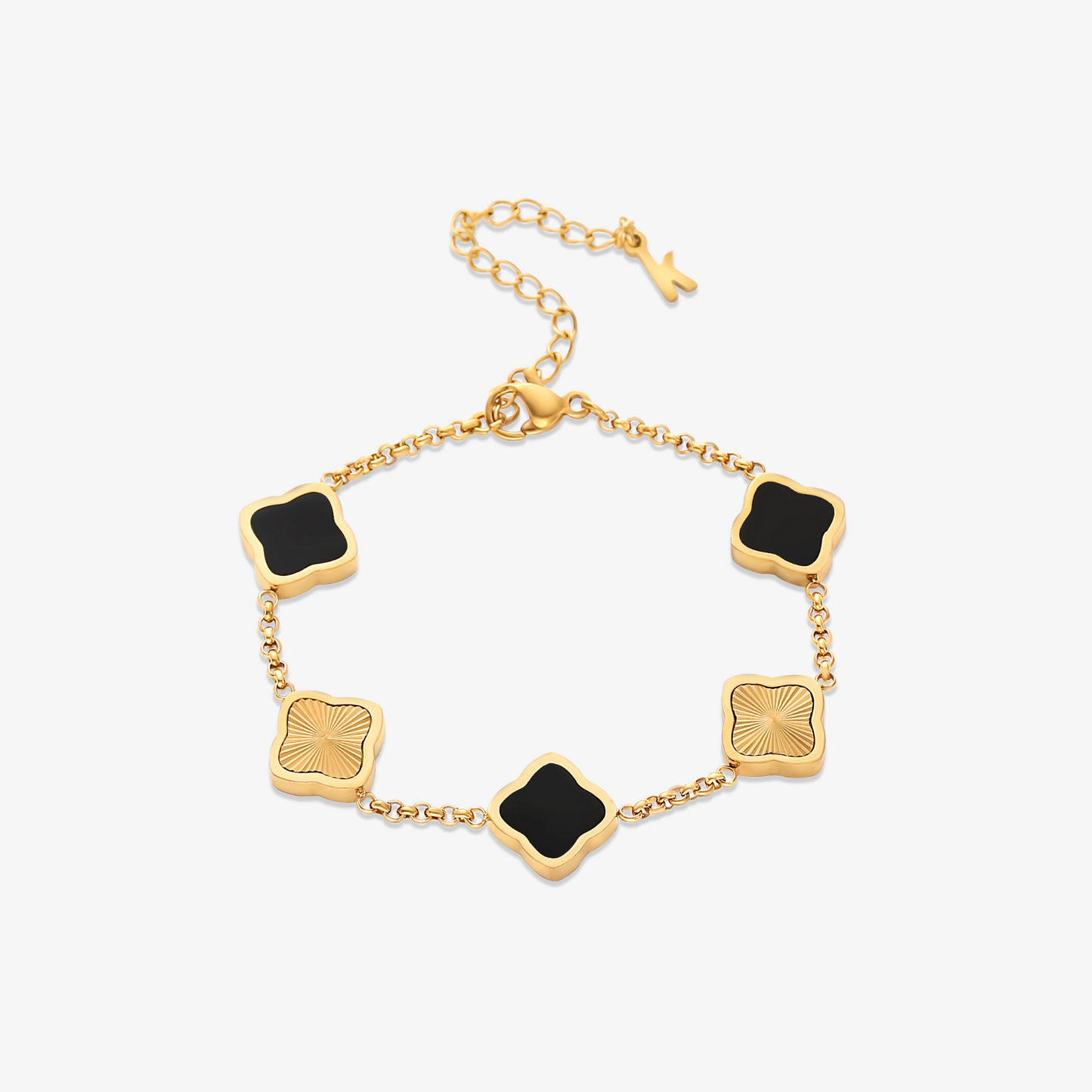 Pulsera trévol de la marca NOA FERRER con diseño elegante y detalles en tonos oscuros y dorados.