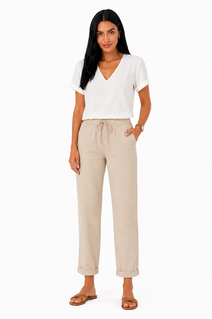 Pantalón fluido con cintura elástica de la marca Vera Serrat, en color oscuro, con diseño cómodo y moderno.