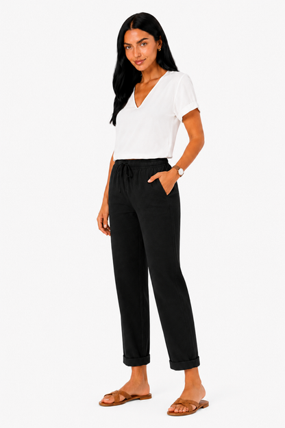 Pantalón fluido con cintura elástica de Vera Serrat, tela suave y cómoda, en color neutro, vista frontal del producto.