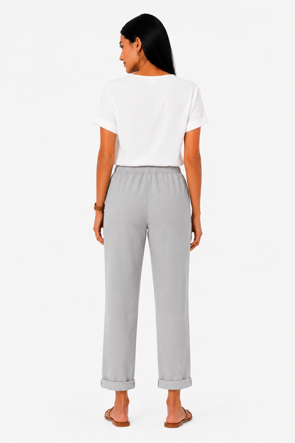 Pantalón fluido con cintura elástica de la marca Vera Serrat, en color neutro, con diseño cómodo y moderno.