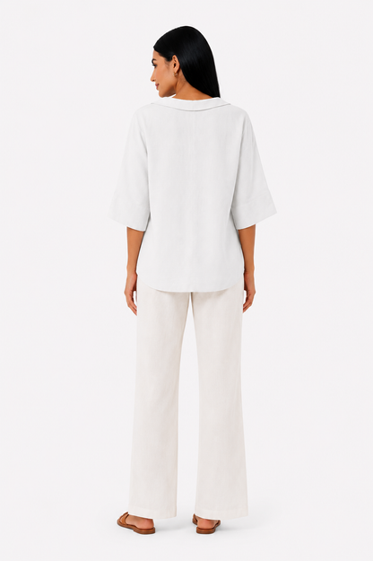 Blusa blanca de corte fluido de la marca Vera Serrat, con diseño elegante y tejido ligero para mujer.