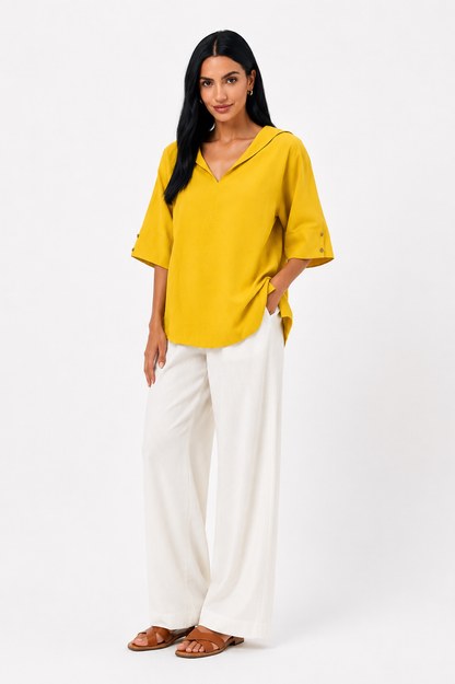 Blusa blanca de corte fluido Lucía de Vera Serrat, con diseño elegante y estilo cómodo para mujer.