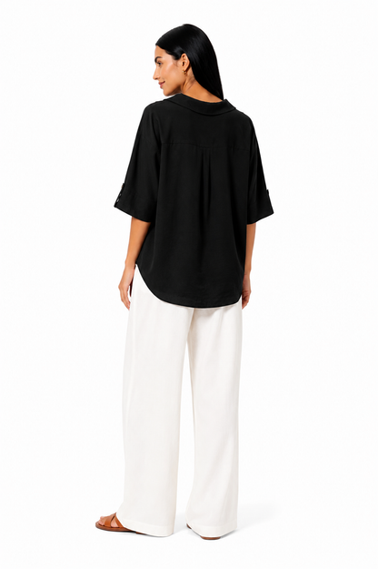 Blusa blanca de corte fluido de la marca Vera Serrat, con diseño ligero y elegante, perfecta para un estilo sofisticado.