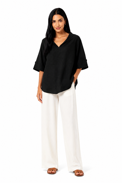 Blusa blanca de corte fluido de la marca Vera Serrat, con diseño elegante y tejido suave.