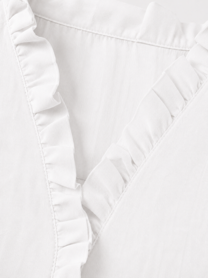 Camisa de algodón y lino con volantes de la marca Vera Serrat, en color blanco, con detalles elegantes y estilo fresco.