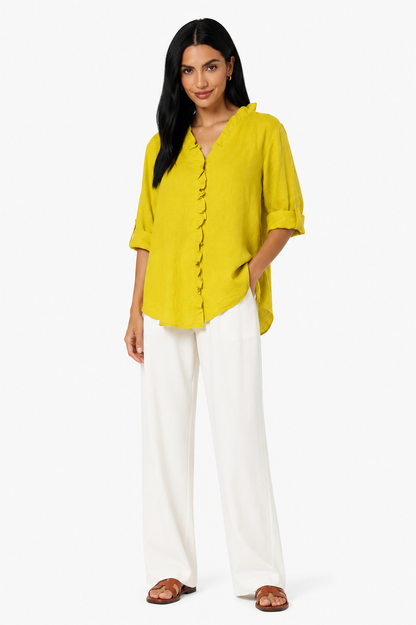 Camisa de algodón y lino con volantes de la marca Vera Serrat, en color blanco, con detalles delicados y estilo femenino.