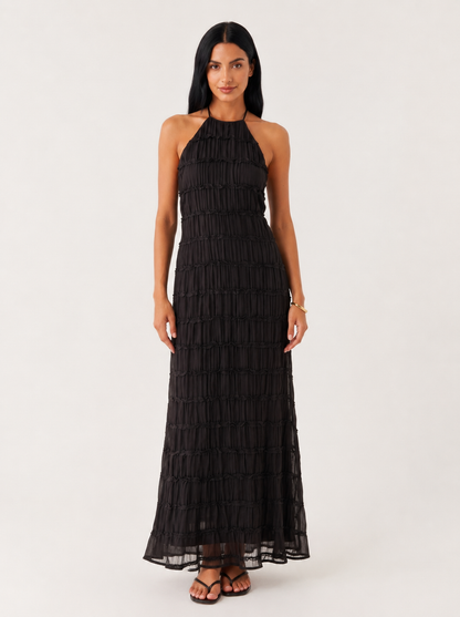 Vestido largo de verano Ángela de NOA FERRER, con diseño fluido y detalles elegantes, ideal para días soleados y ocasiones especiales.