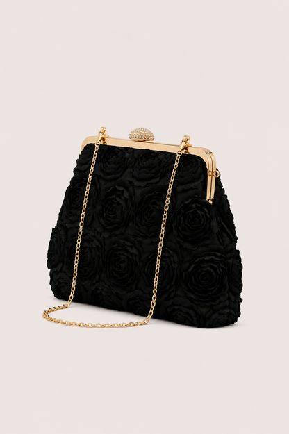 Bolso de mano elegante Vera Serrat Flora, diseño sofisticado y compacto, con detalles en tonos neutros.