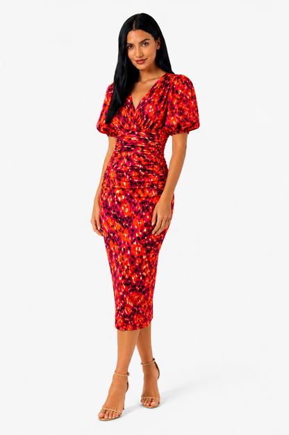 Vestido midi estampado con mangas abullonadas de la marca Vera Serrat, mostrando el diseño y los detalles del vestido en la imagen.