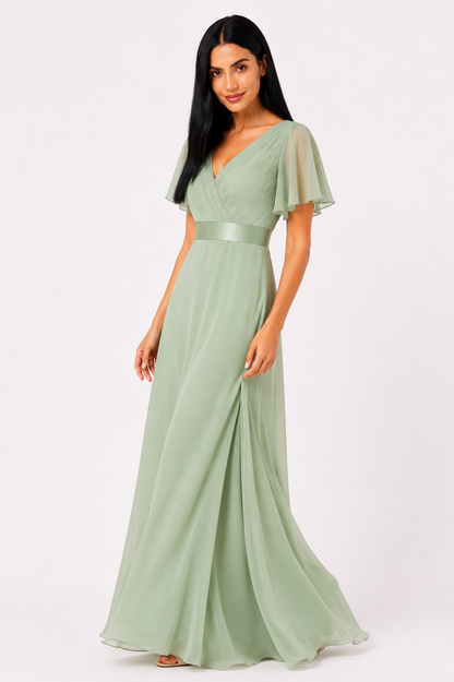 Vestido de gasa elegante de talle alto de la marca Vera Serrat, en color suave, con detalles delicados y diseño sofisticado.