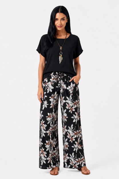 Conjunto floral de dos piezas Vera Serrat con blusa y pantalón de pierna ancha, diseño elegante y cómodo para mujer.