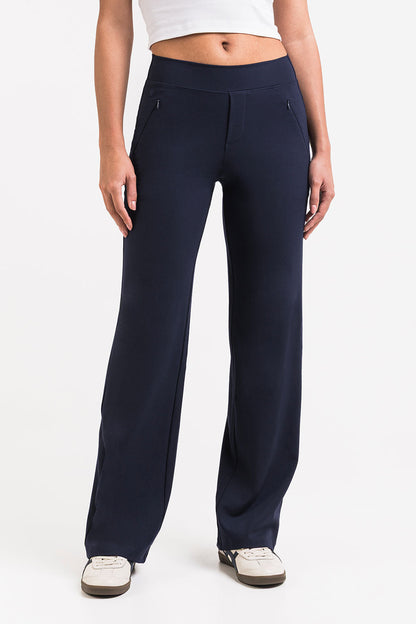 Pantalón elástico de tiro medio MADLADY en color negro, vista frontal que muestra la cintura y el tejido ajustado.