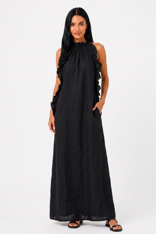 Vestido maxi fluido de Vera Serrat con volantes y bolsillos, diseñado para un estilo cómodo y elegante.